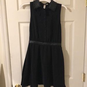 Black dress with leather collar and cutouts